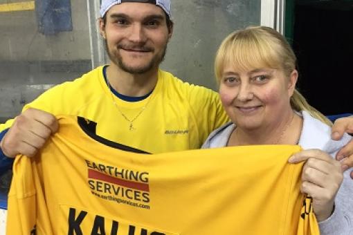 Shirt off his back winner Tracey gets her prize from Petr Kalus