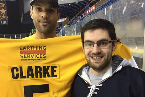 Shirt raffle winner Alex snags Clarkey's shirt
