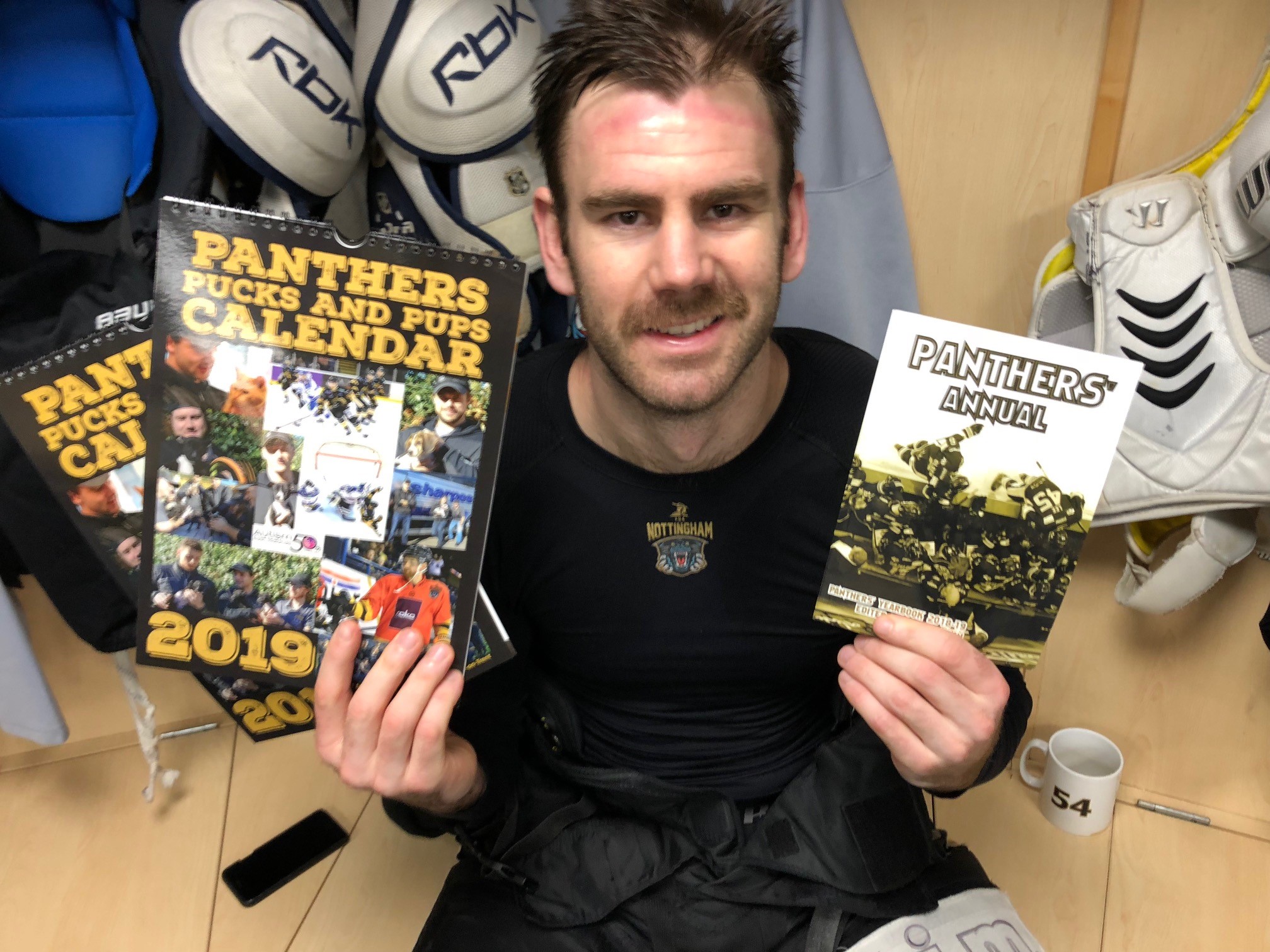 Team to sign books and calendars Top Image